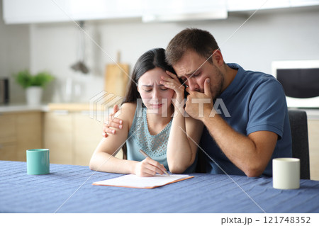 Sar interracial couple reading paper contract 121748352