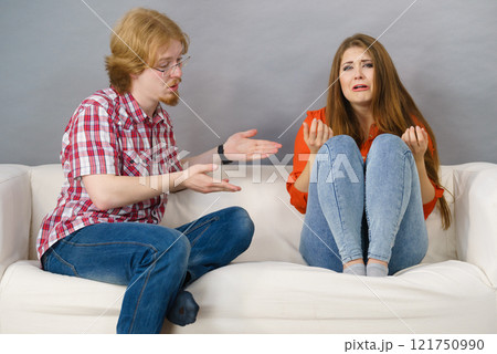 Woman and man after argue on sofa Woman and man after argue on sofa 121750990