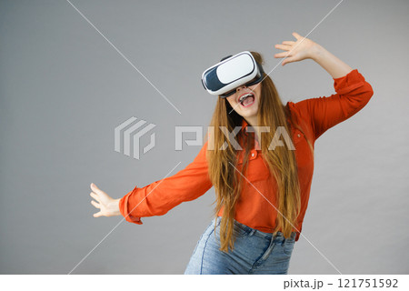 Girl wearing virtual reality goggles. 121751592