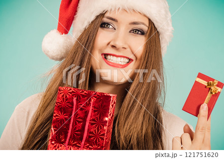 Happy Christmas woman holds red gift box Happy Christmas woman holds red gift box 121751620