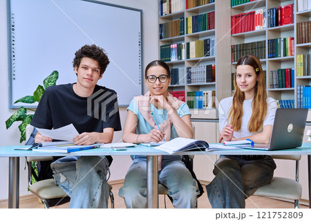 Group of high school students studying in library classroom 121752809
