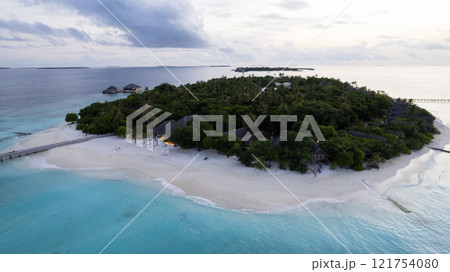 Top view of the sunset over an island in the ocean 121754080