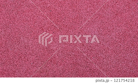 full frame red pink texture, crushed rubber sports surface, reddish grainy soft material, graphic resource and empty textured space 121754218