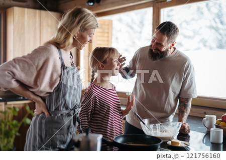 Family making pancakes, preparing sweet breakfast in the morning. Family making pancakes, preparing sweet breakfast in the morning. 121756160