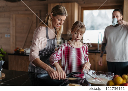 Family making pancakes, preparing sweet breakfast in the morning. Family making pancakes, preparing sweet breakfast in the morning. 121756161
