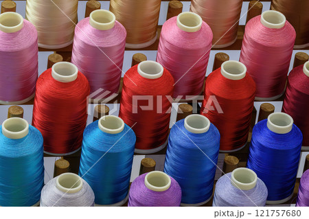 Close up the multi-color group of industry bobbin thread. Close up the multi-color group of industry bobbin thread. 121757680
