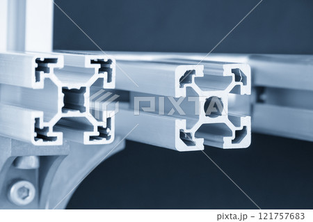 Close up scene the sample parts of aluminum profile extrusion manufacturing concept in the light blue scene. Close up scene the sample parts of aluminum profile extrusion manufacturing concept in the light blue scene. 121757683