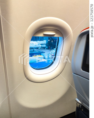 Atlanta, Georgia, USA - 01.05.2025: View of the baggage loading area through the airplane window 121758570