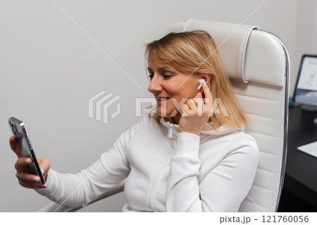 woman using smartphone woman using smartphone 121760056