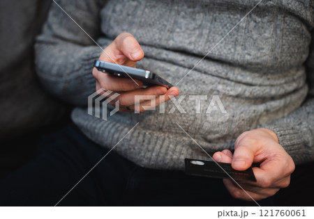 man use smartphone and credit card 121760061
