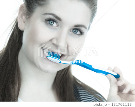 Woman brushing cleaning teeth. 121761115