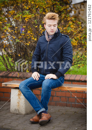 Young handsome man outdoors 121761482