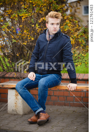 Young handsome man outdoors 121761483