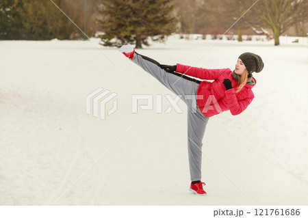 Woman wearing sportswear training boxing outside Woman wearing sportswear training boxing outside 121761686
