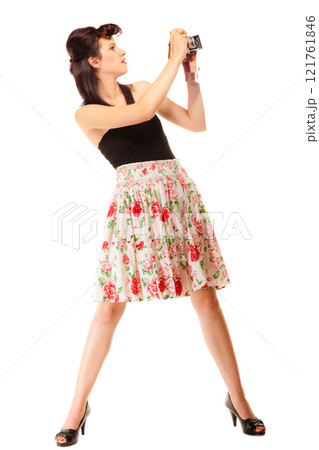 Teen girl with old camera 121761846