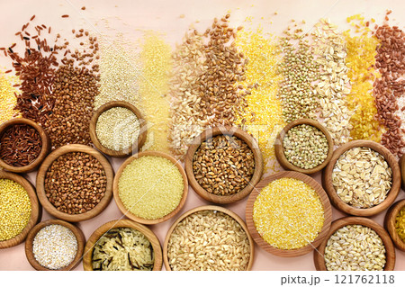 Colorful mix of grain varieties: oat and wheat, rice and millet, buckwheat and barley, quinoa and polenta. Food ingridients for healthy diet background, selective focus 121762118