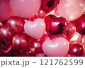 A Valentine's Day background with heart-shaped balloons in shades of pink. Valentine's day background. 121762599
