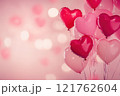 A Valentine's Day background with heart-shaped balloons in shades of pink. Valentine's day background. 121762604