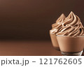 Side view of mocha or chocolate mousse dessert with smooth texture, soft brown background. Color trend concept, color of the year 2025. Banner with copy space. 121762605