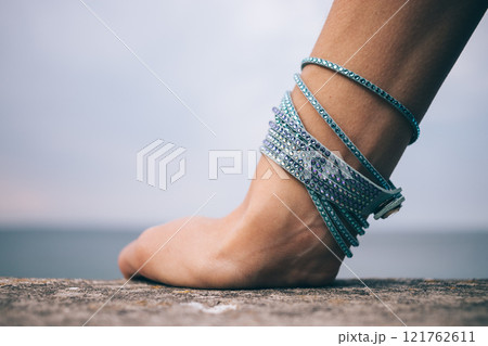 A person's hand with a bracelet on it A person's hand with a bracelet on it 121762611