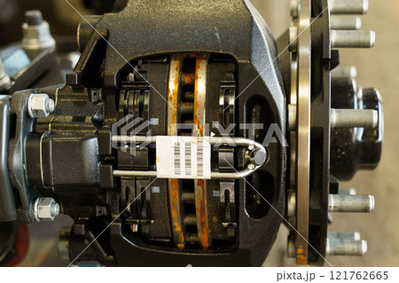 Close-up view of a brake system showcasing intricate components and details Close-up view of a brake system showcasing intricate components and details 121762665