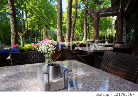 Flowers in Vase on a Table in a Street Cafe in Palanga, Lithuania. 121763567