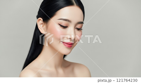 Elegant asian female with flawless makeup and smooth hair in a minimalist setting Elegant asian female with flawless makeup and smooth hair in a minimalist setting 121764230