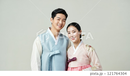 Cultural heritage and diversity: young asian couple in traditional korean hanbok clothing 121764304