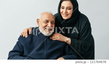 Elderly caucasian male and adult middle eastern female in heartfelt family moment Elderly caucasian male and adult middle eastern female in heartfelt family moment 121764676