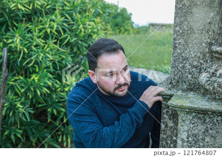 Man Hiding From Someone Searching For Him Man Hiding From Someone Searching For Him 121764807