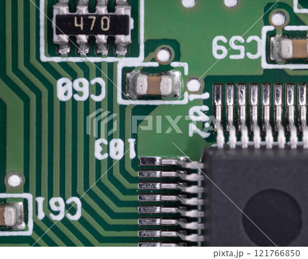 Close up of circuit board with integrated circuit and capacitors Close up of circuit board with integrated circuit and capacitors 121766850