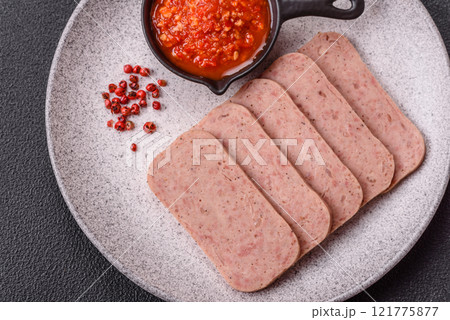 Delicious canned pink spiced ham or spam with salt, spices and herbs Delicious canned pink spiced ham or spam with salt, spices and herbs 121775877