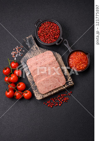 Delicious canned pink spiced ham or spam with salt, spices and herbs Delicious canned pink spiced ham or spam with salt, spices and herbs 121775897