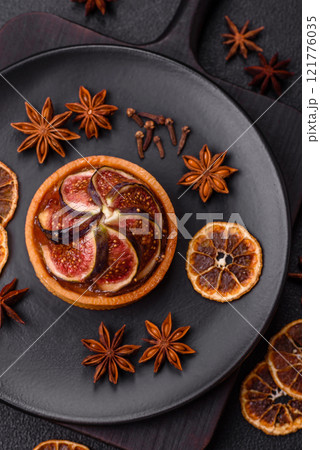 Sweet tart with figs, cheese cream and pecans 121776035