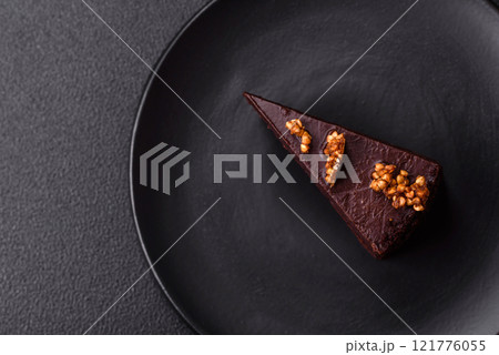Piece of sweet chocolate cake with nuts Piece of sweet chocolate cake with nuts 121776055