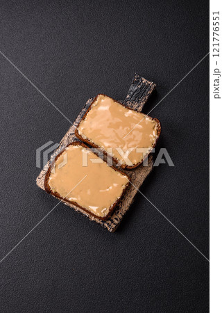 Sandwiches with toast bread, peanut butter and raspberry or strawberry jam Sandwiches with toast bread, peanut butter and raspberry or strawberry jam 121776551