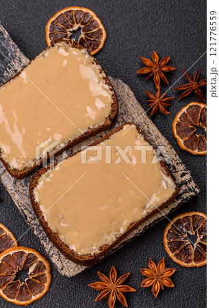 Sandwiches with toast bread, peanut butter and raspberry or strawberry jam 121776559