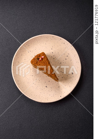 Piece of sweet layered honey cake Piece of sweet layered honey cake 121776919
