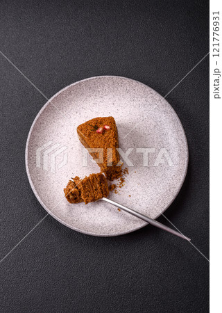Piece of sweet layered honey cake Piece of sweet layered honey cake 121776931