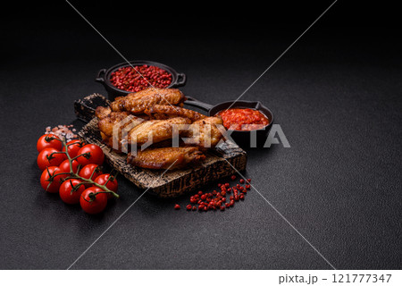 Grilled chicken wings with salt, spices and herbs Grilled chicken wings with salt, spices and herbs 121777347