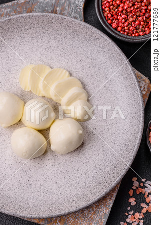 Delicious fresh mozzarella cheese with tomatoes, salt and spices 121777689
