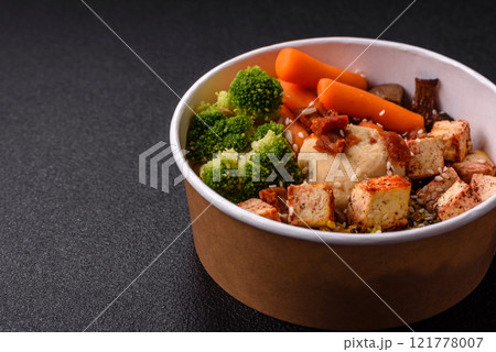 Colorful vegan vegetarian dish consists of tofu, broccoli, quinoa, mushrooms 121778007