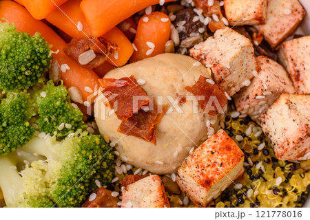 Colorful vegan vegetarian dish consists of tofu, broccoli, quinoa, mushrooms Colorful vegan vegetarian dish consists of tofu, broccoli, quinoa, mushrooms 121778016