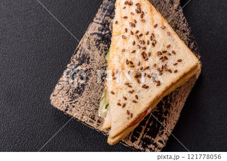Sandwich with toast bread, meat, tomatoes, cheese, sauce, salt and spices Sandwich with toast bread, meat, tomatoes, cheese, sauce, salt and spices 121778056