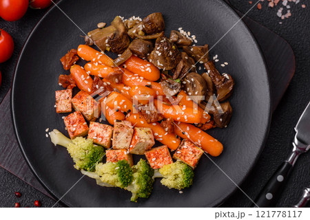 Colorful vegan vegetarian dish consists of tofu, broccoli, quinoa, mushrooms 121778117