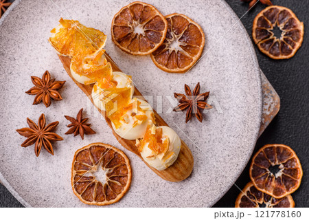 Sweet dessert eclairs or profiteroles with chocolate filling Sweet dessert eclairs or profiteroles with chocolate filling 121778160