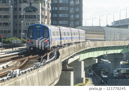 View of a Taoyuan International Airport line train running on the elevated track of the Taoyuan Mass Rapid Transit System. View of a Taoyuan International Airport line train running on the elevated track of the Taoyuan Mass Rapid Transit System. 121778245