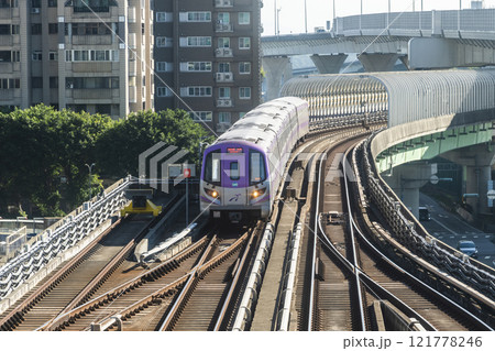 View of a Taoyuan International Airport line train running on the elevated track of the Taoyuan Mass Rapid Transit System. 121778246