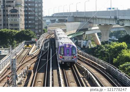 View of a Taoyuan International Airport line train running on the elevated track of the Taoyuan Mass Rapid Transit System. 121778247