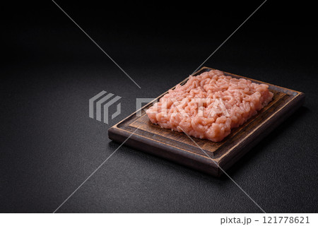 Fresh raw chicken mince with salt, spices and herbs 121778621